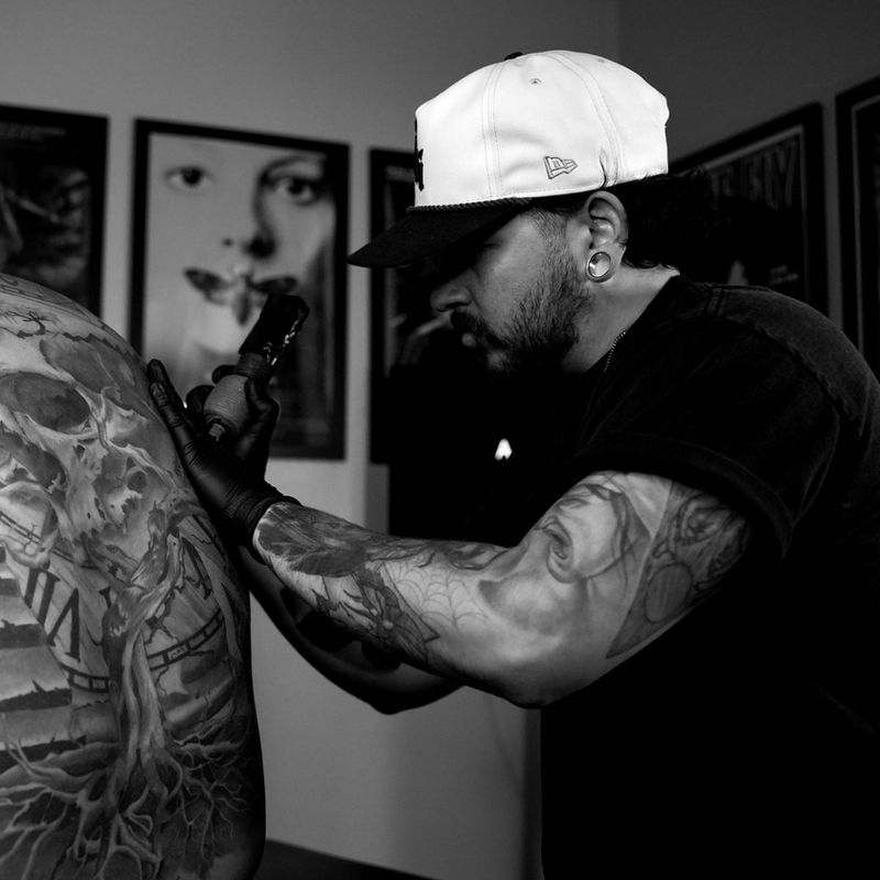 NicK tattooing at Pale Horse Collective