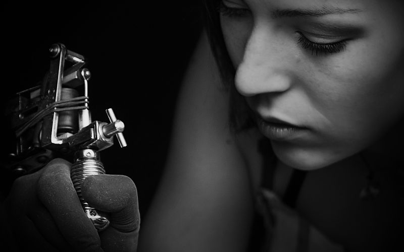 Tattoo artist at work at Pale Horse Collective